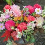 Vibrant fresh flower bouquet with roses, daisies, and wild blooms