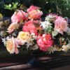 Coral peony and peach rose bouquet with burgundy fillers