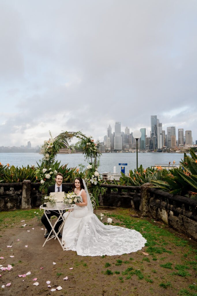 Elegant white bridal bouquet with roses and seasonal blooms by Sydney wedding florist