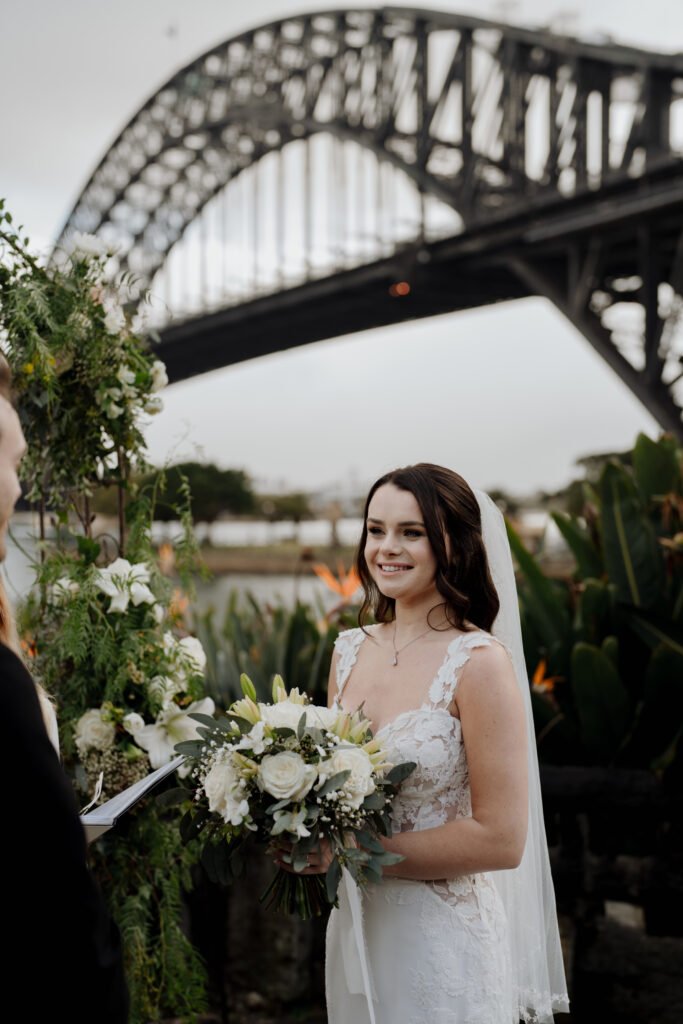 Romantic outdoor garden wedding ceremony flowers with floral arch in Sydney