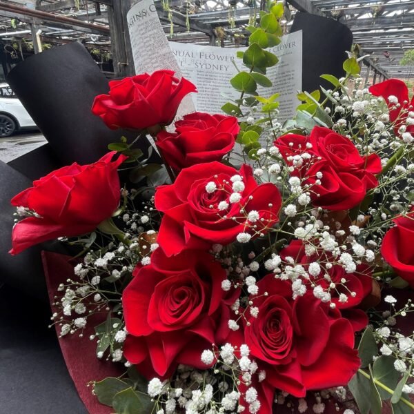 Red rose bouquet with baby’s breath and eucalyptus foliage