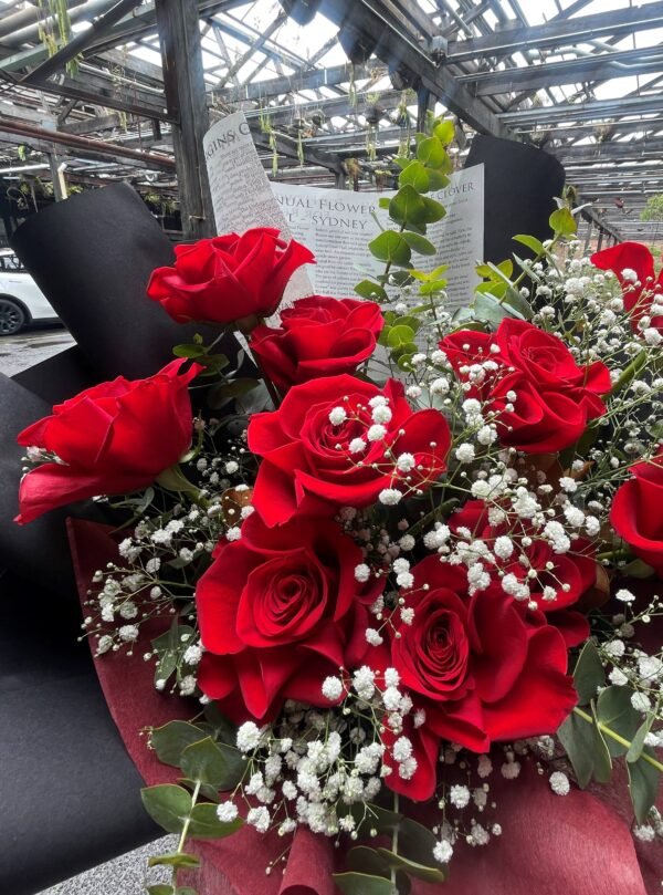 Red rose bouquet with baby’s breath and eucalyptus foliage