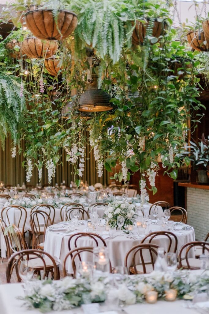 Romantic wedding reception table flowers with candlelight and garden-inspired floral styling in Sydney