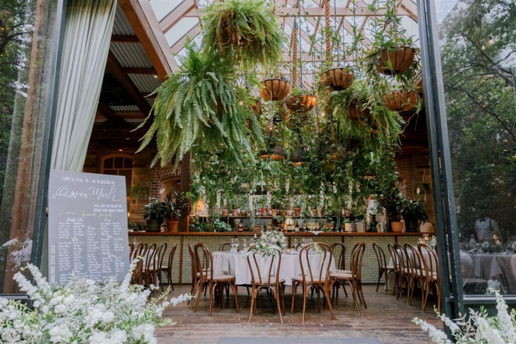 Elegant wedding ceremony floral installation with fresh white flowers and greenery in Sydney wedding venue