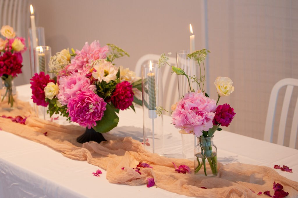 Romantic wedding reception table flowers with candlelight and garden-inspired floral styling in Sydney