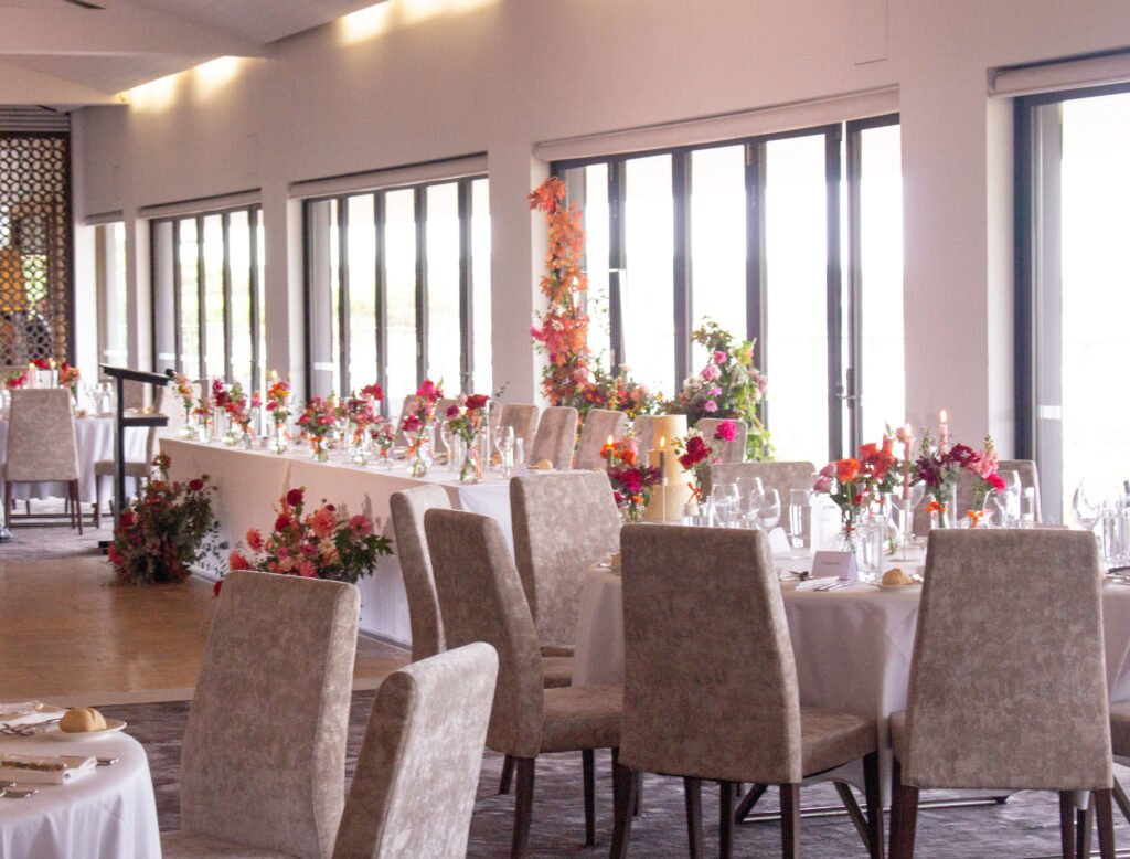 Romantic wedding reception table flowers with candlelight and garden-inspired floral styling in Sydney